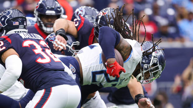 Oct 30, 2022; Houston, Texas, USA; Tennessee Titans running back Derrick Henry (22) runs with the ball during the first quarter against the Houston Texans at NRG Stadium. Mandatory Credit: Troy Taormina-USA TODAY Sports